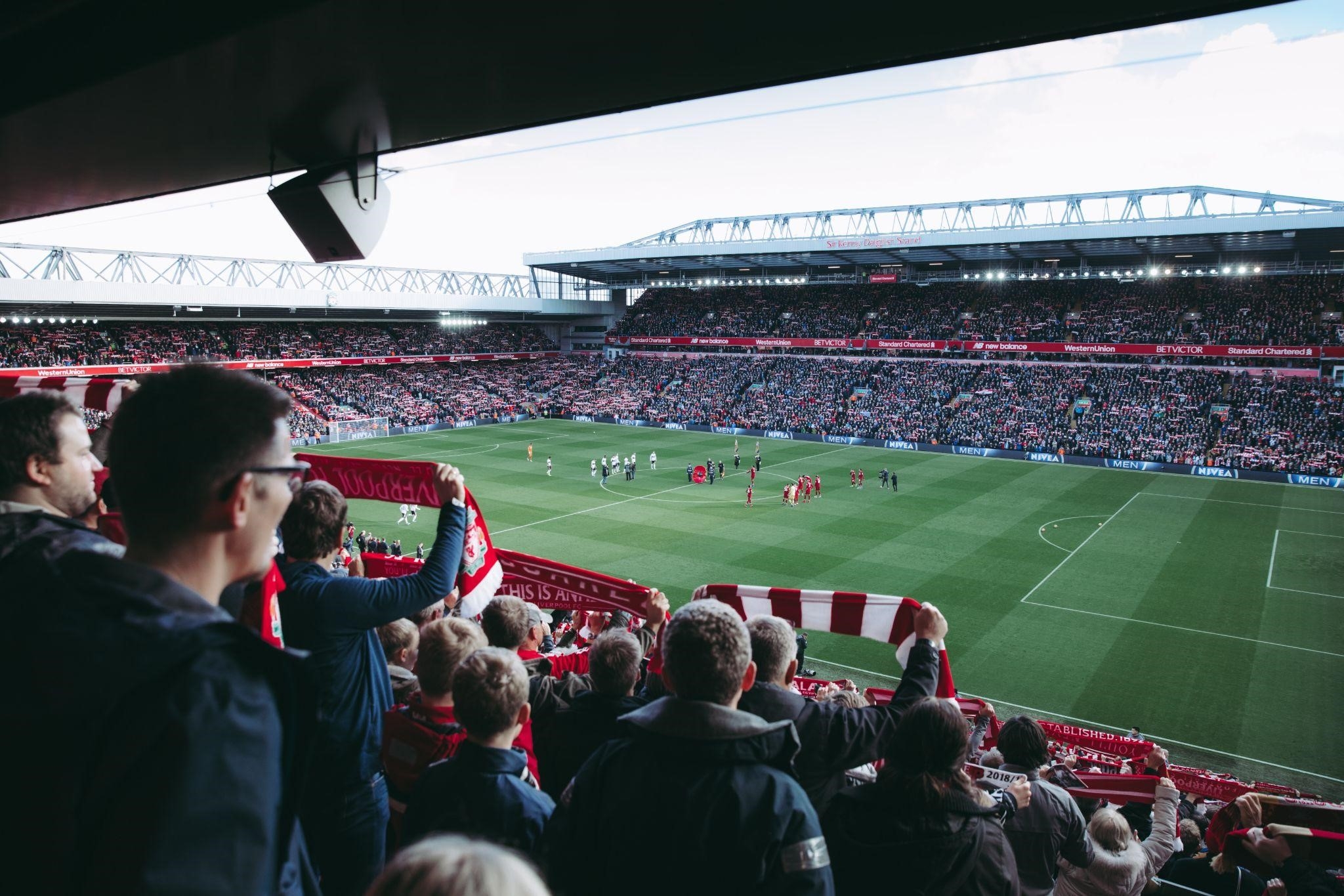 spectators in stadium watching football event