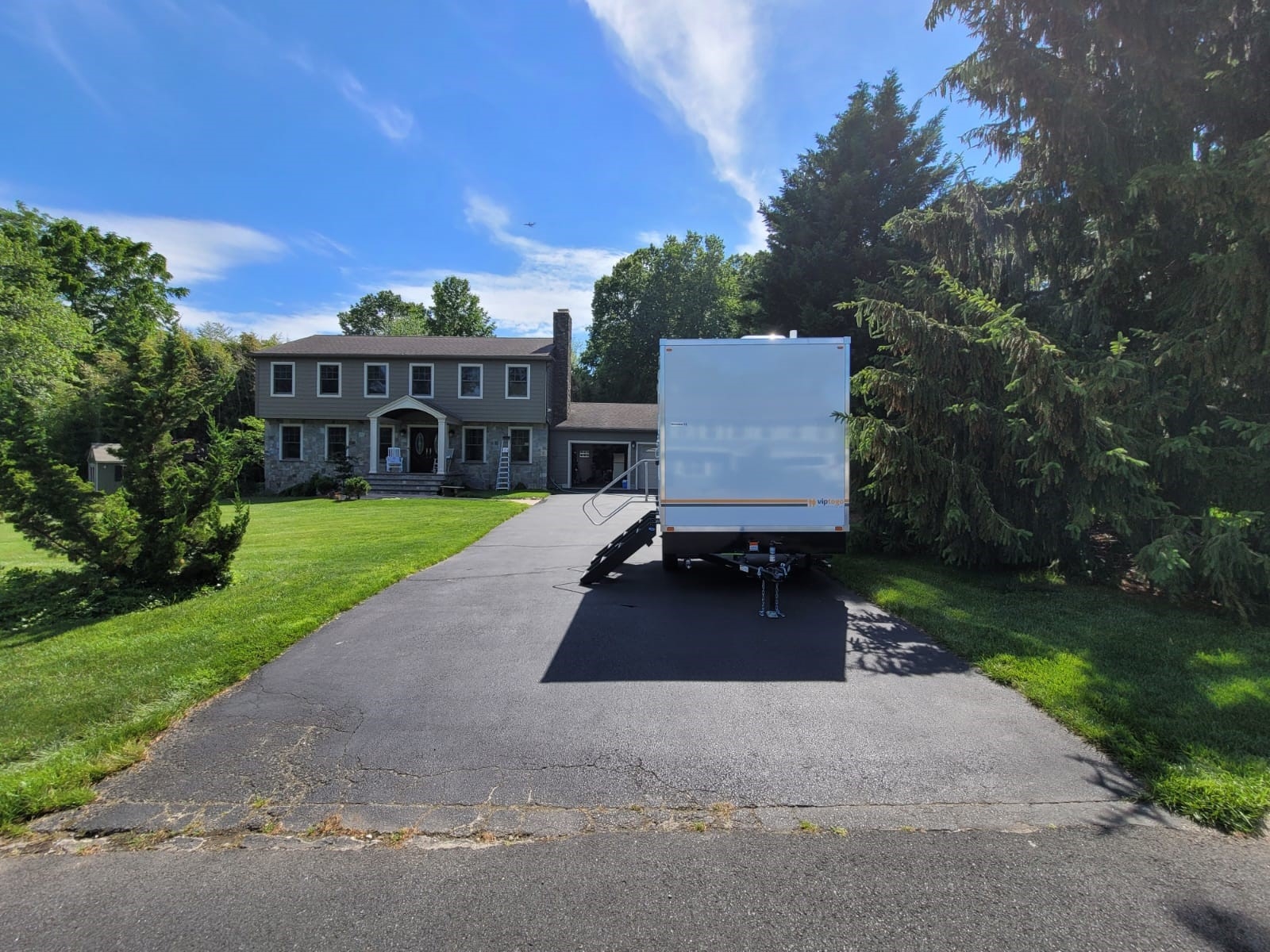 Bathroom trailer outside home