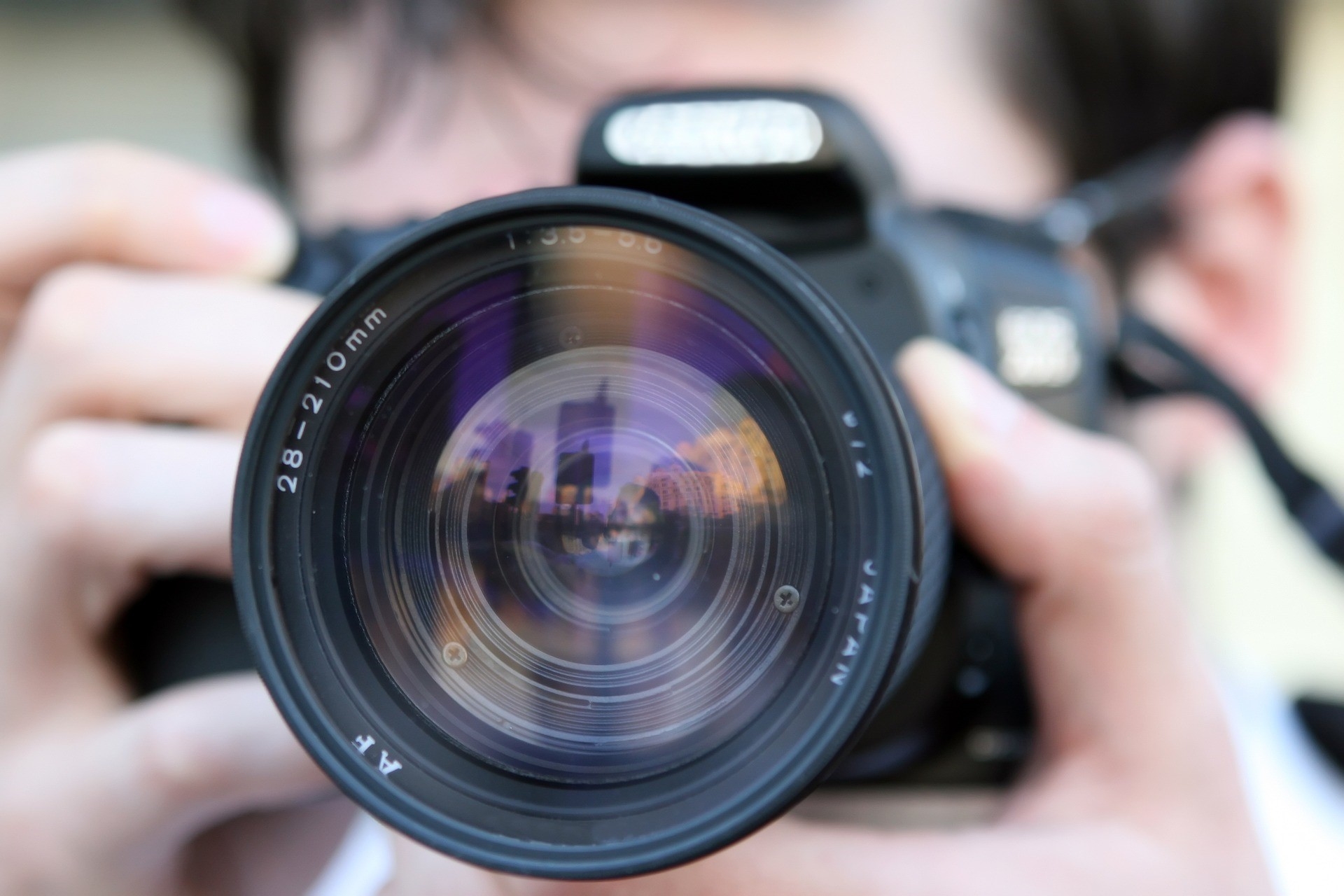 close up of photographer with camera