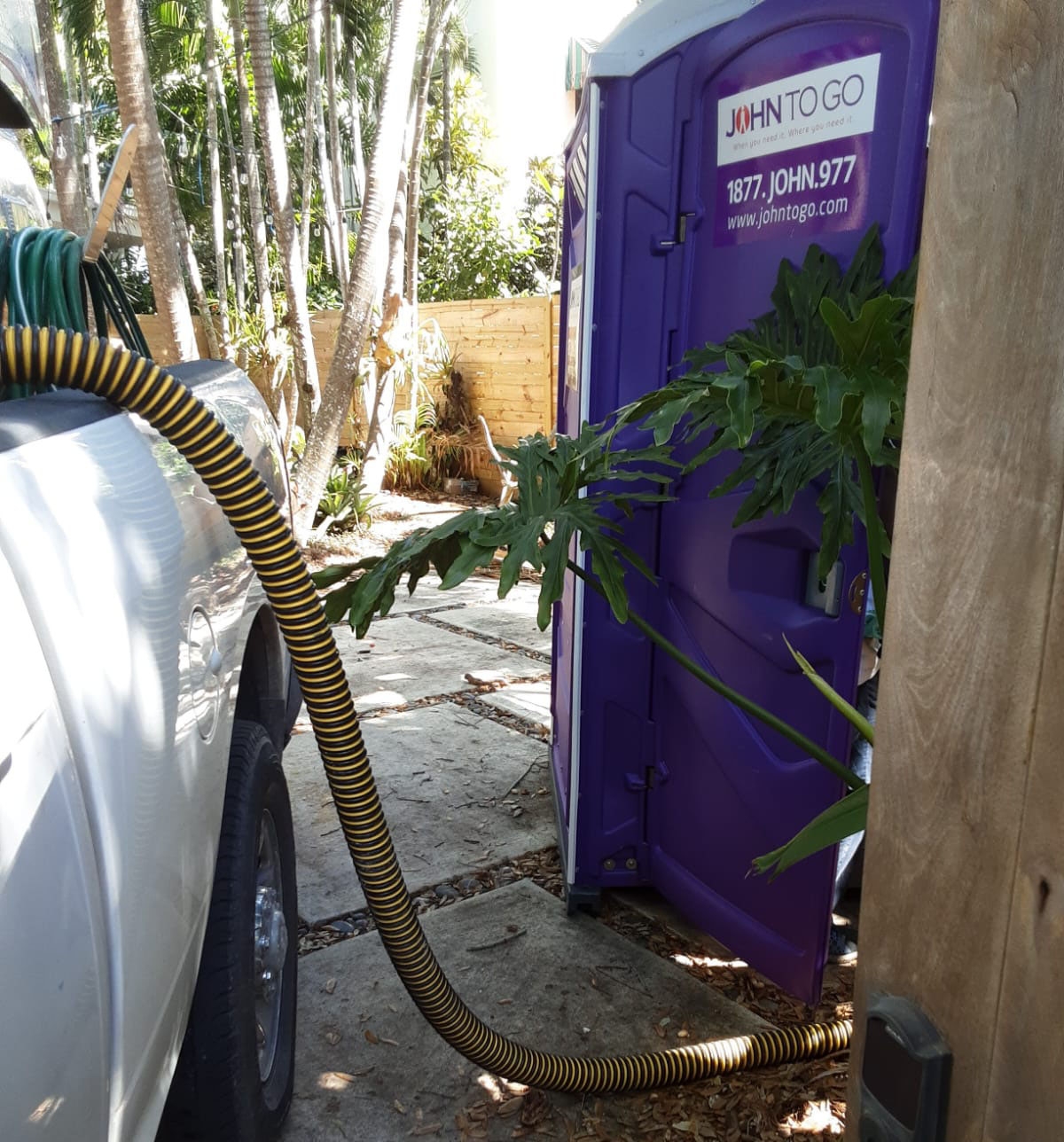 Pumper truck servicing porta potty rental in Miami