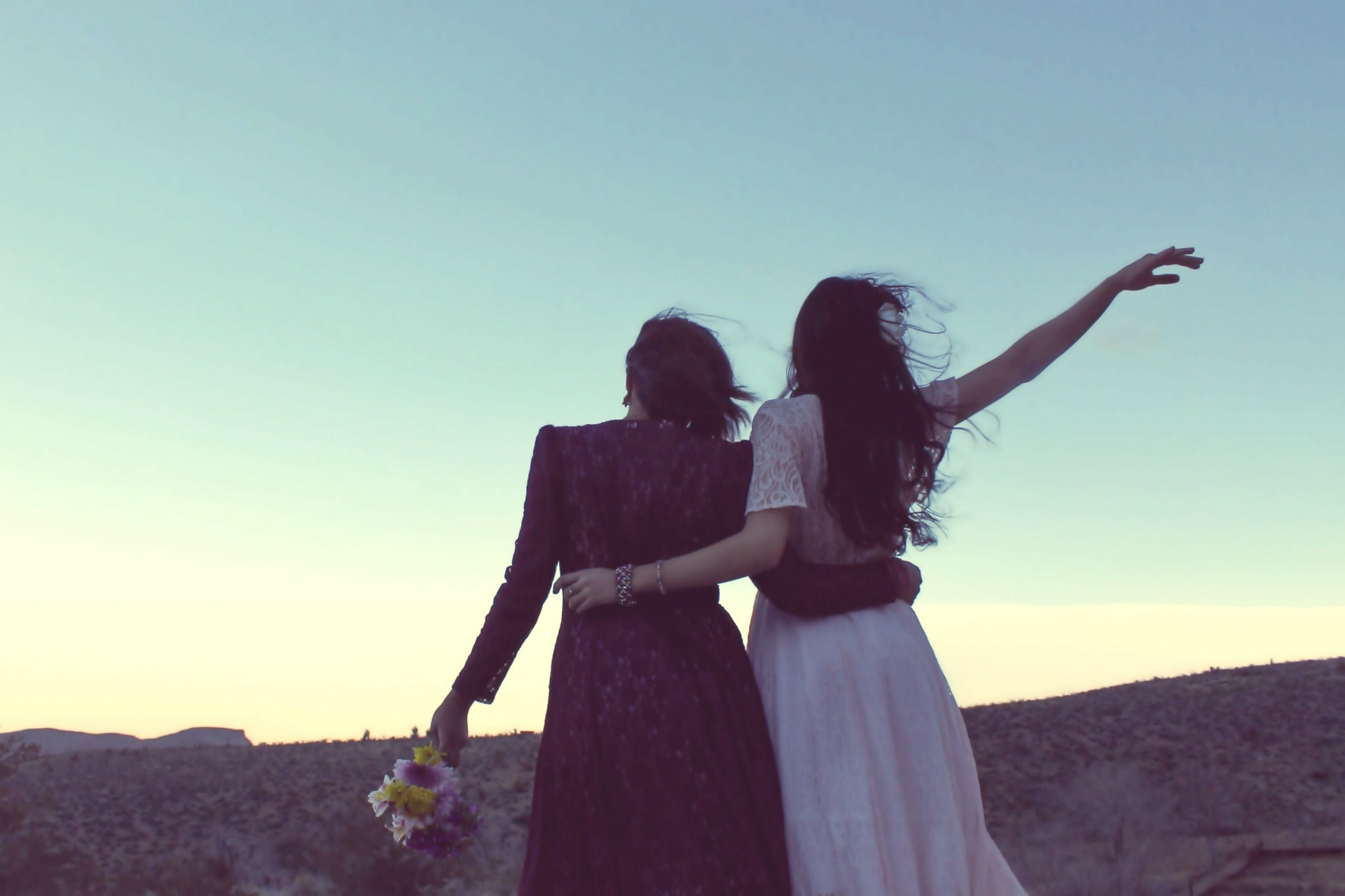 girlfriends walking in sunset