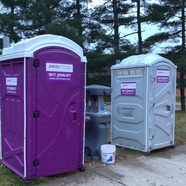 portable hand wash station between port o potties