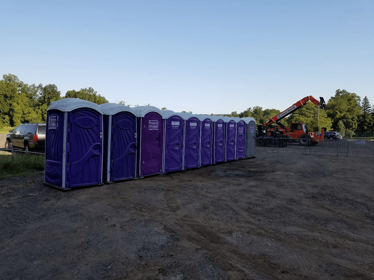 porta potties neatly arranged on a construction site
