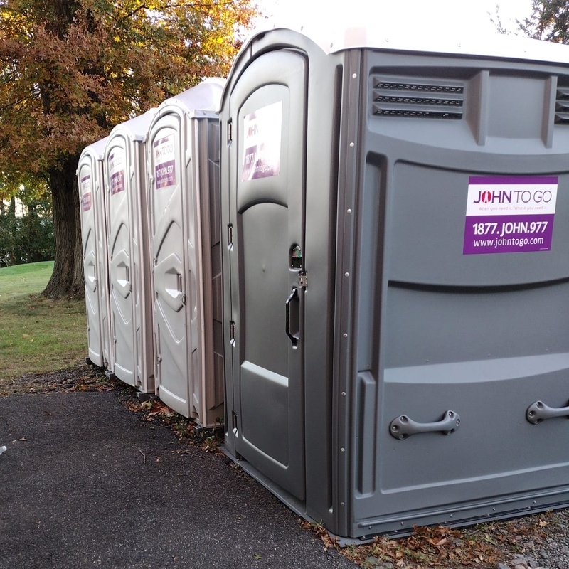 Porta johns setup for outdoor gatherings