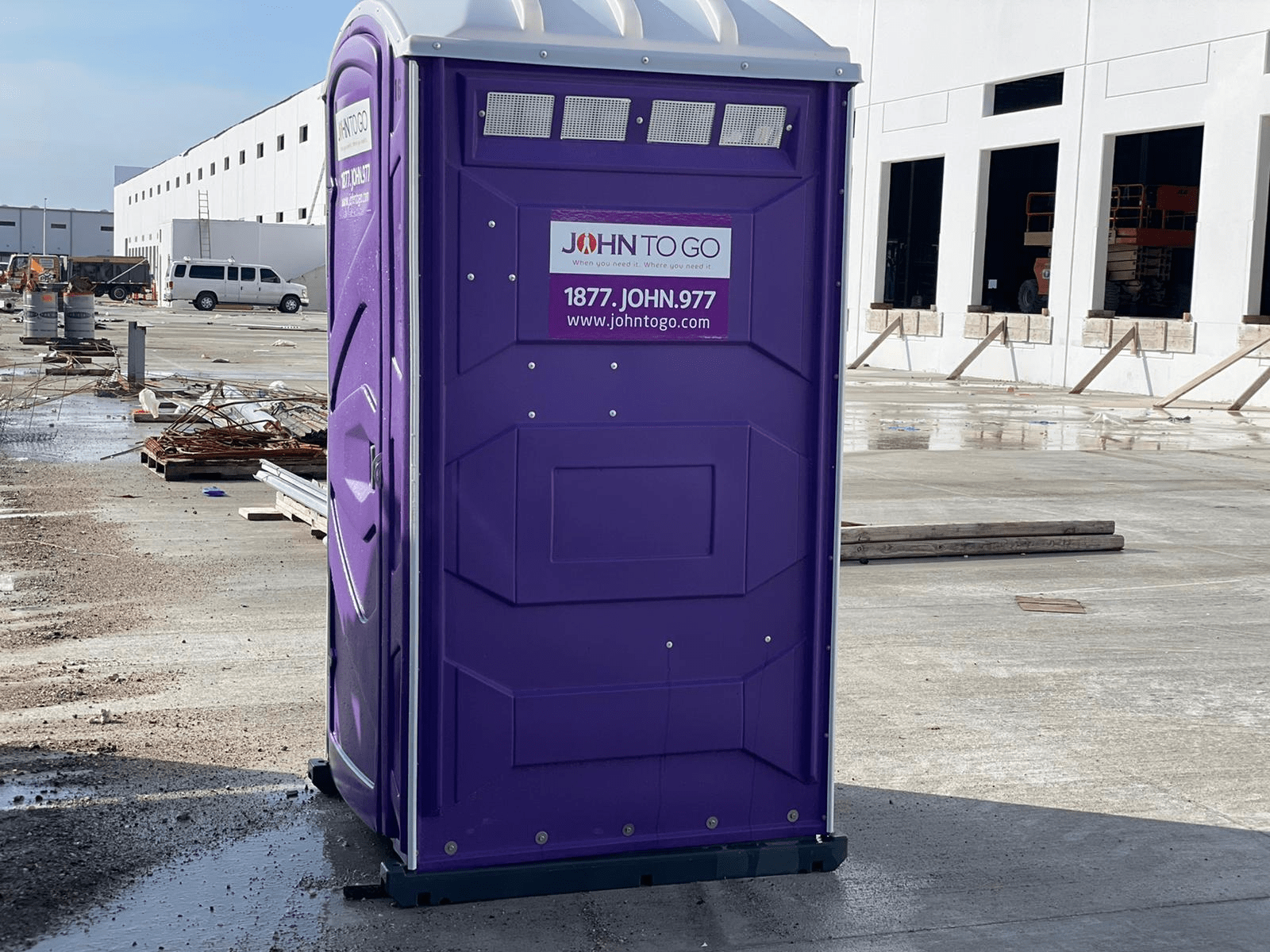 A portable toilet strategically located at a construction site