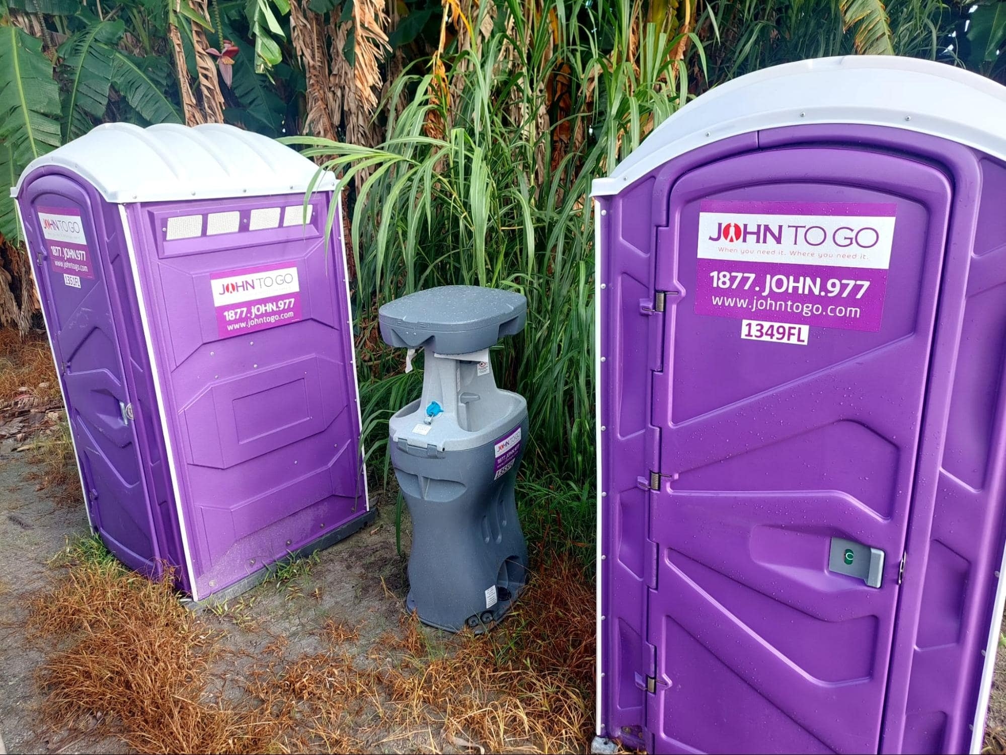 Portable hand washing station with toilets at an outdoor event