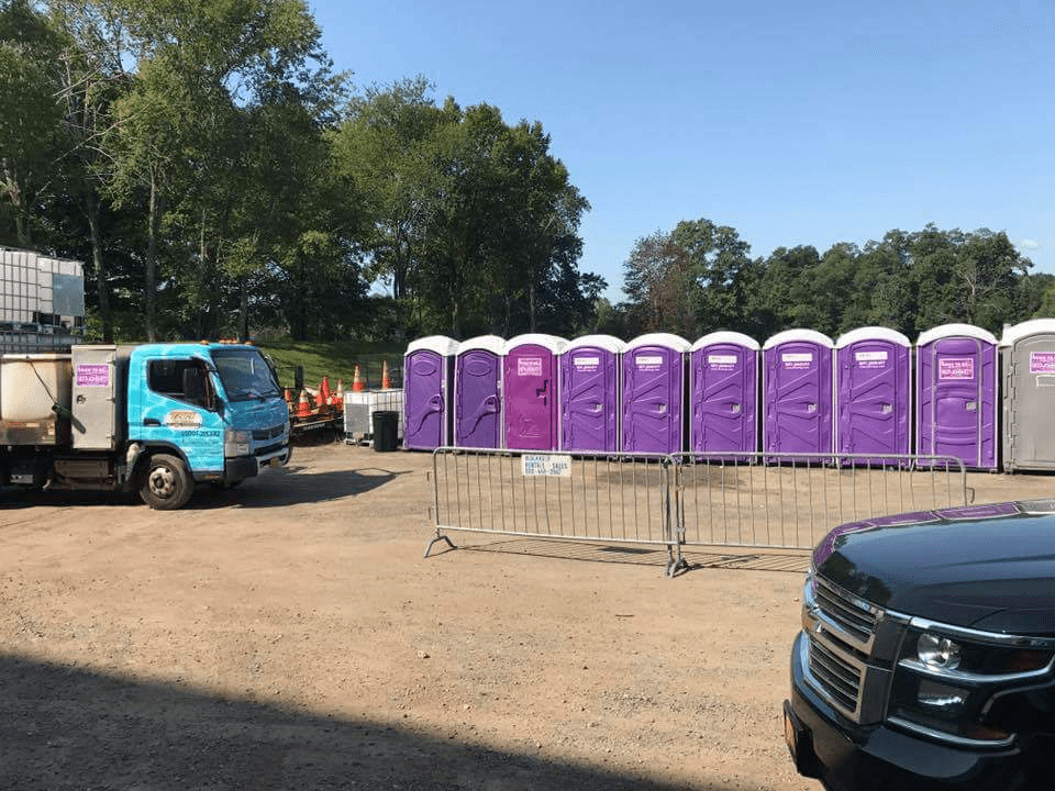 Portable toilets situated at an outdoor event