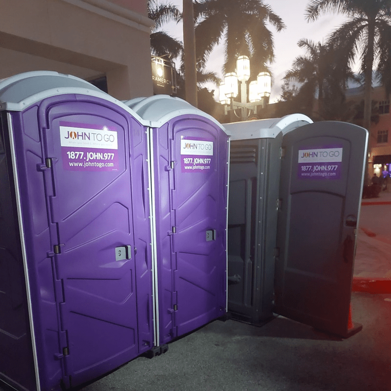 Premium flushing porta potties located at an outdoor event